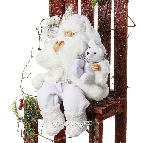 Санта в бело-серебряном кафтане с медвежонком сидящий 31 см Eggl