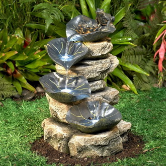 Идеи оформления садового фонтана из камней