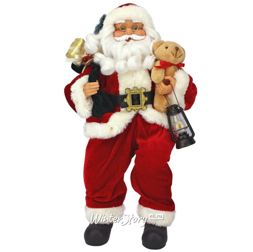 Санта в красном кафтане с медвежонком и мешком подарков 40 см сидящий Eggl