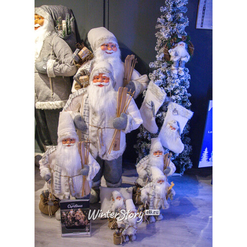 Санта в овечьей шубе с подарками и лыжами 61 см Peha