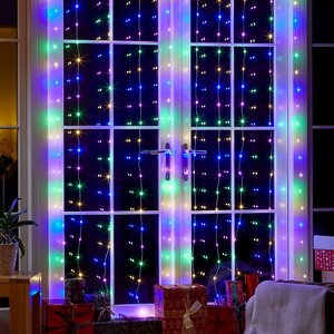 Светодиодная гирлянда на окно Роса Бриллиант 3*3 м, 300 разноцветных мини LED ламп, серебряная проволока, с пультом, IP20 Serpantin фото 1